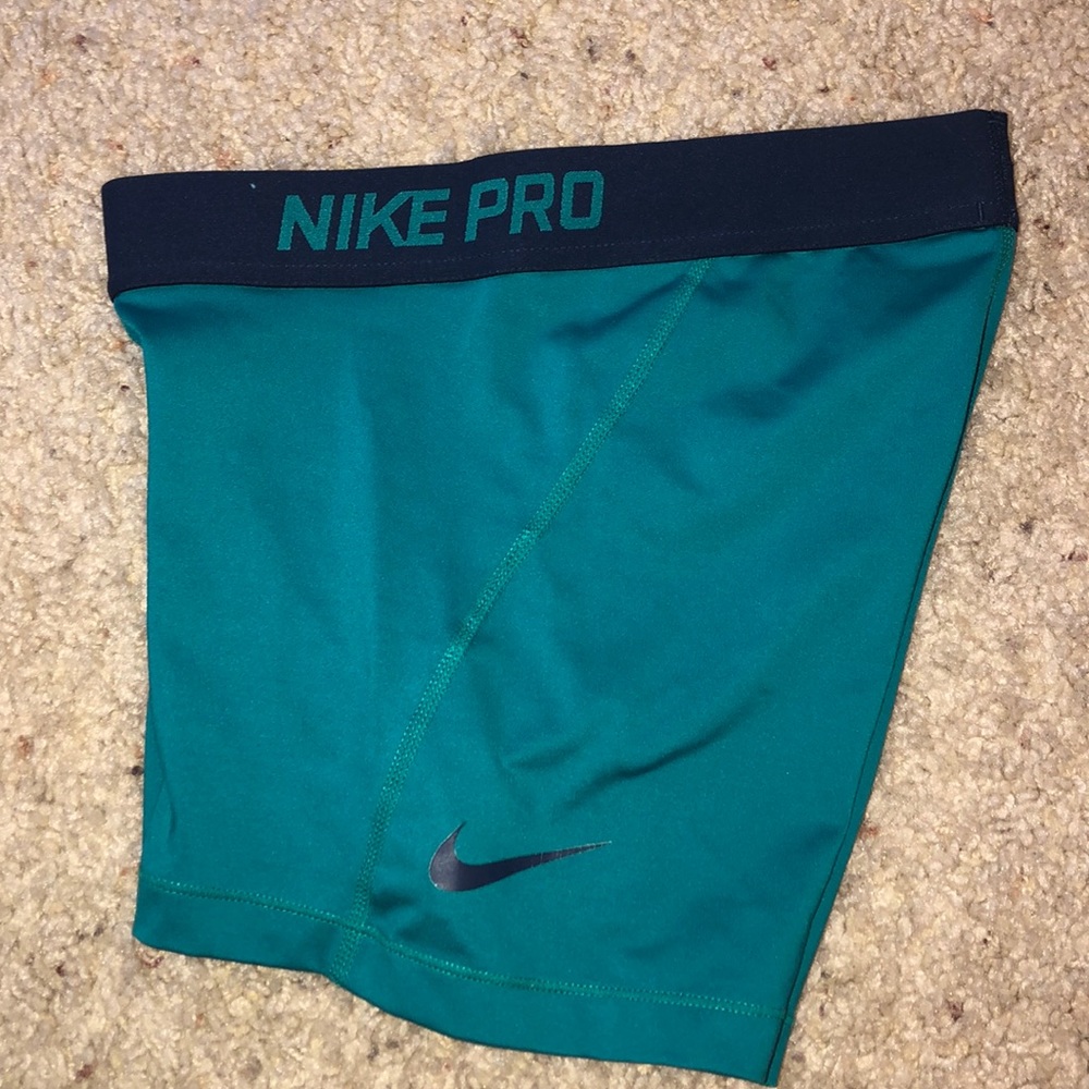 Green/aqua Nike pros.